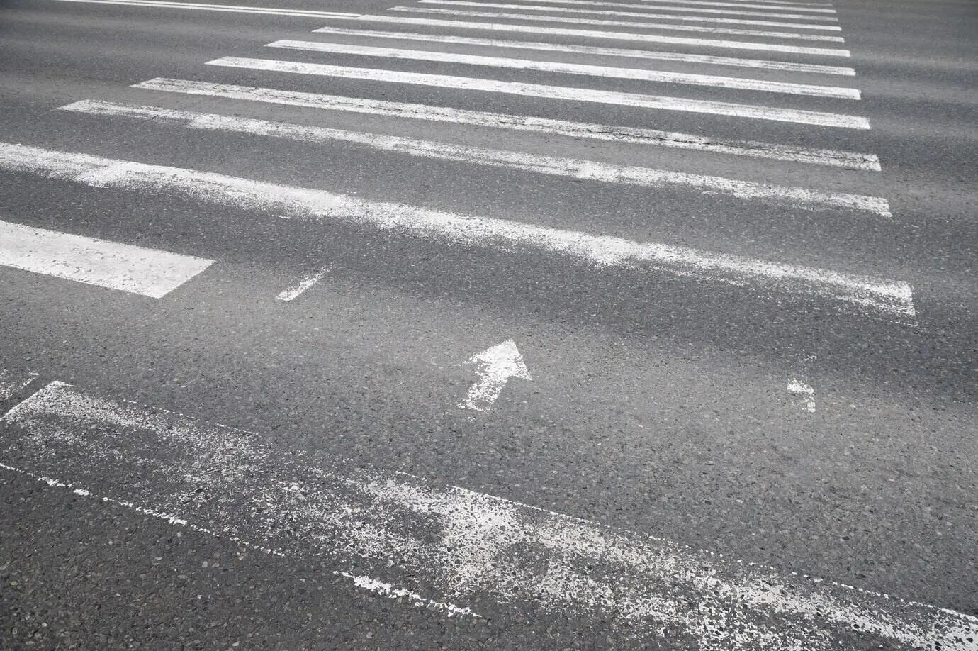 Outdoor cobblestone texture with a crosswalk